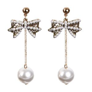 Pearl bow stud earrings