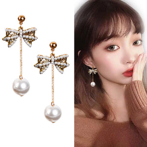 Pearl bow stud earrings